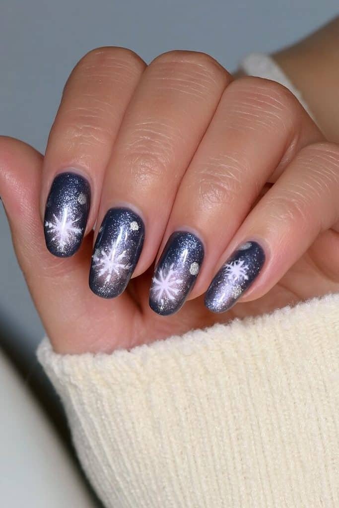 Navy blue nails with white snowflake designs
