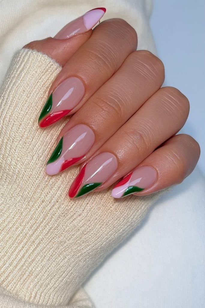 Nude nails with red and green curved accents