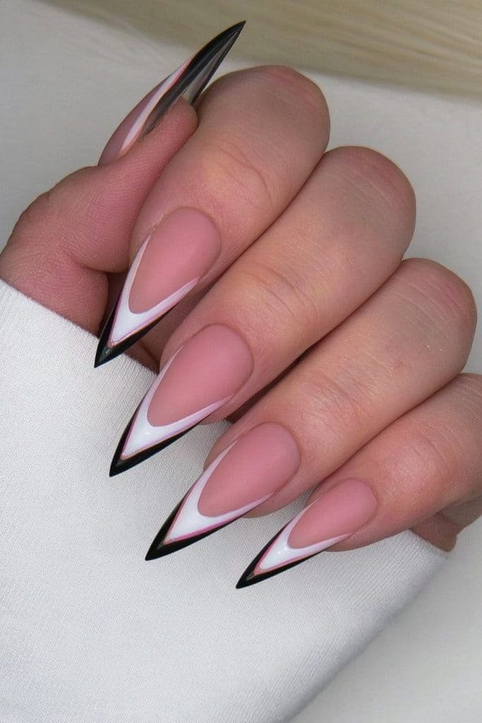 Sheer stiletto tip nails with minimalist negative-space details