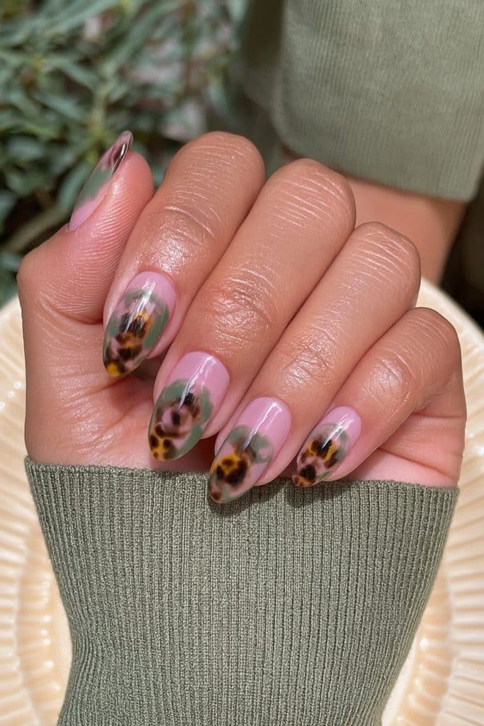 Amber tortoiseshell nails with subtle olive green accents