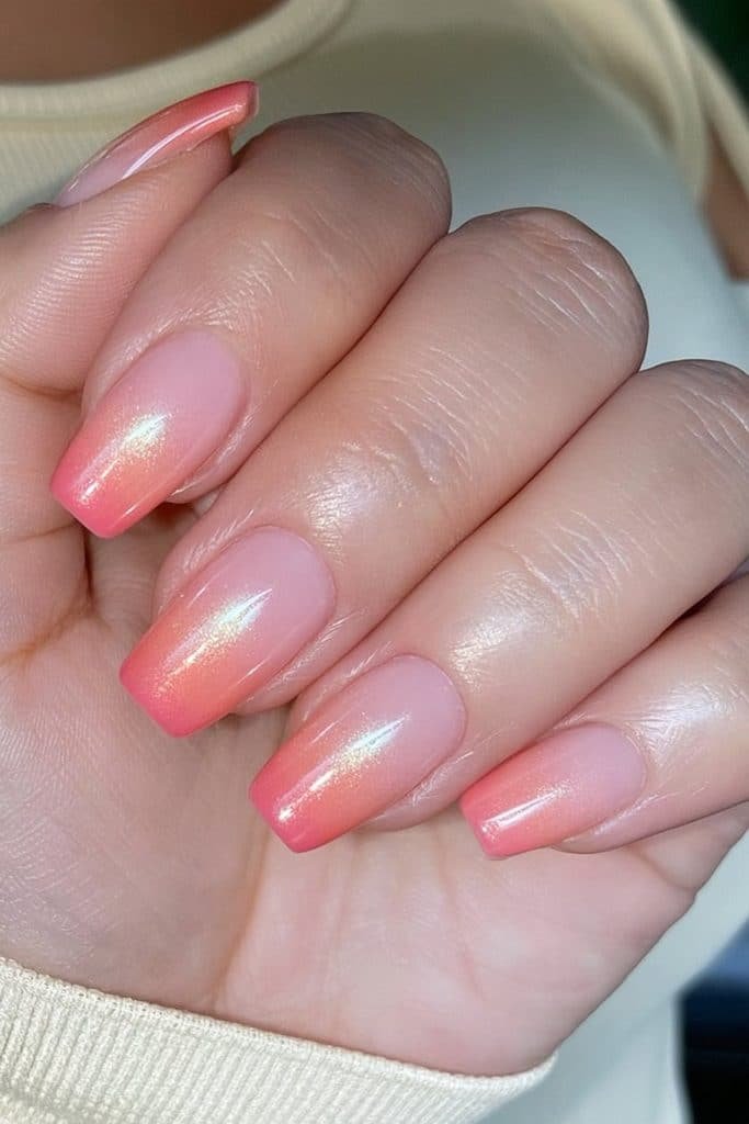 Soft peach ombré coffin nails with glossy finish