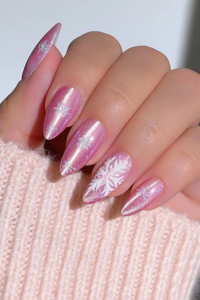 Pink velvet nails with delicate white snowflakes