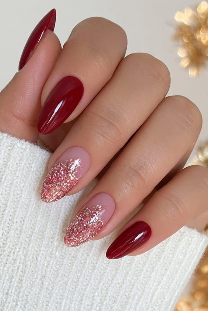 Classic red nails with festive gold glitter accents