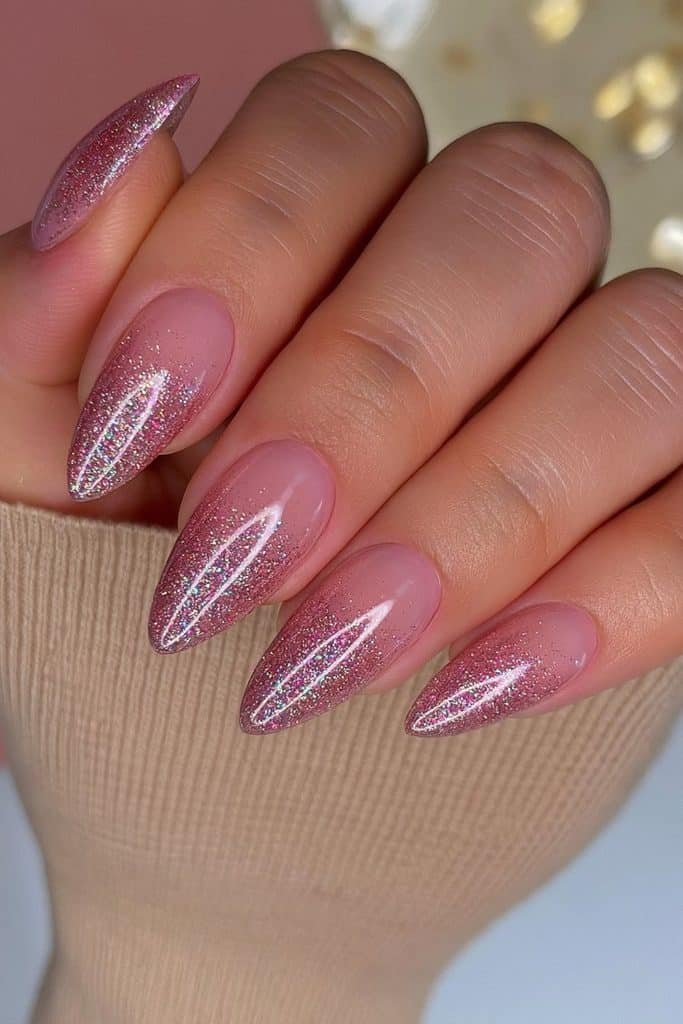 Nude pink nails with luminous rose gold glitter