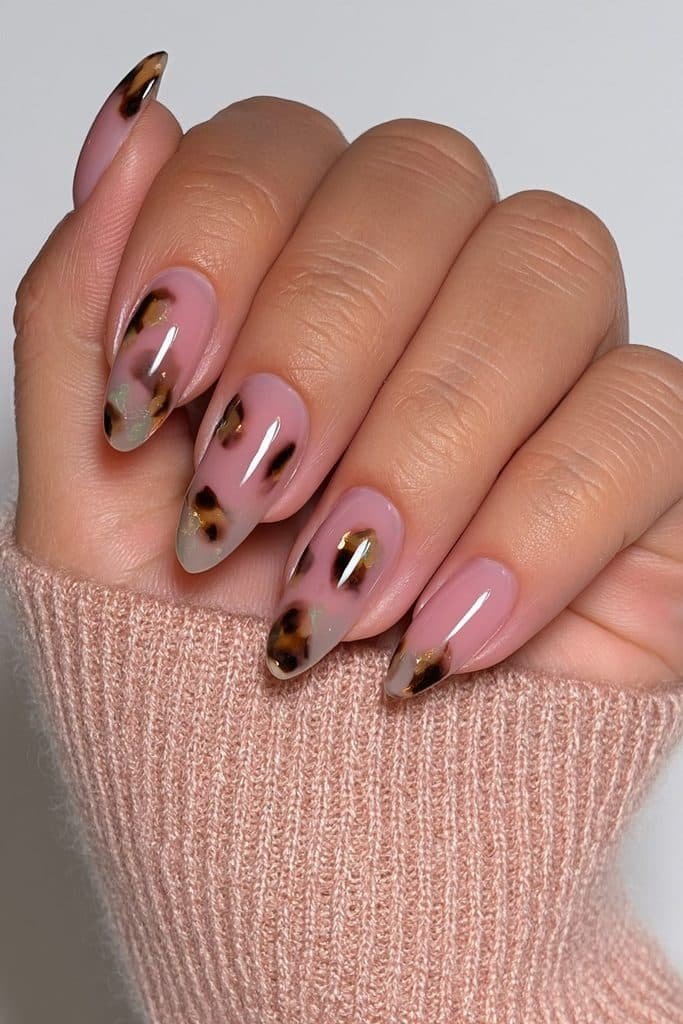 Sheer milky nails with delicate translucent tortoiseshell patches
