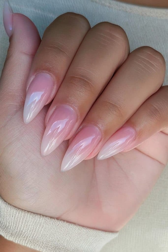 Short neutral stiletto nails with tapered pointed tips