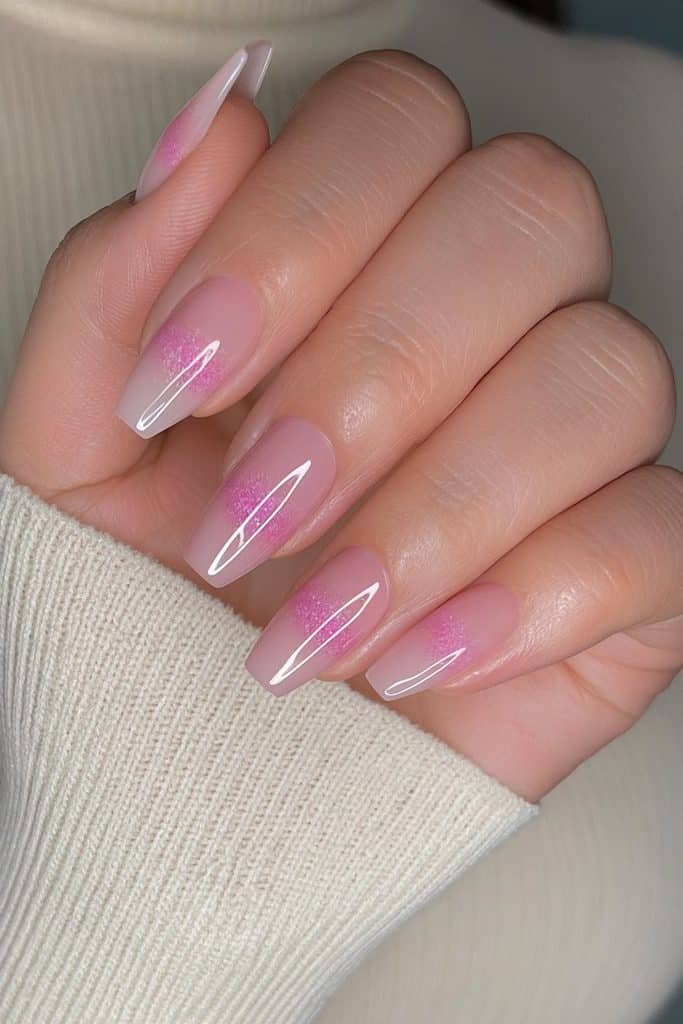 Soft nude coffin nails with diffused peach-pink aura