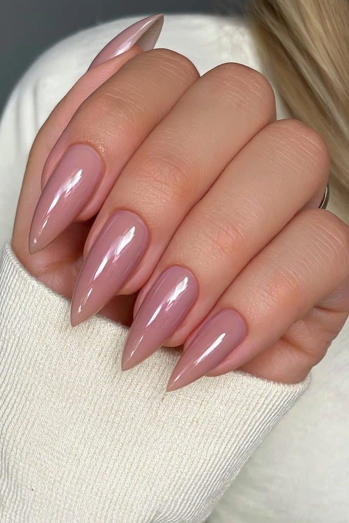 Warm nude beige stiletto nails with glossy shine