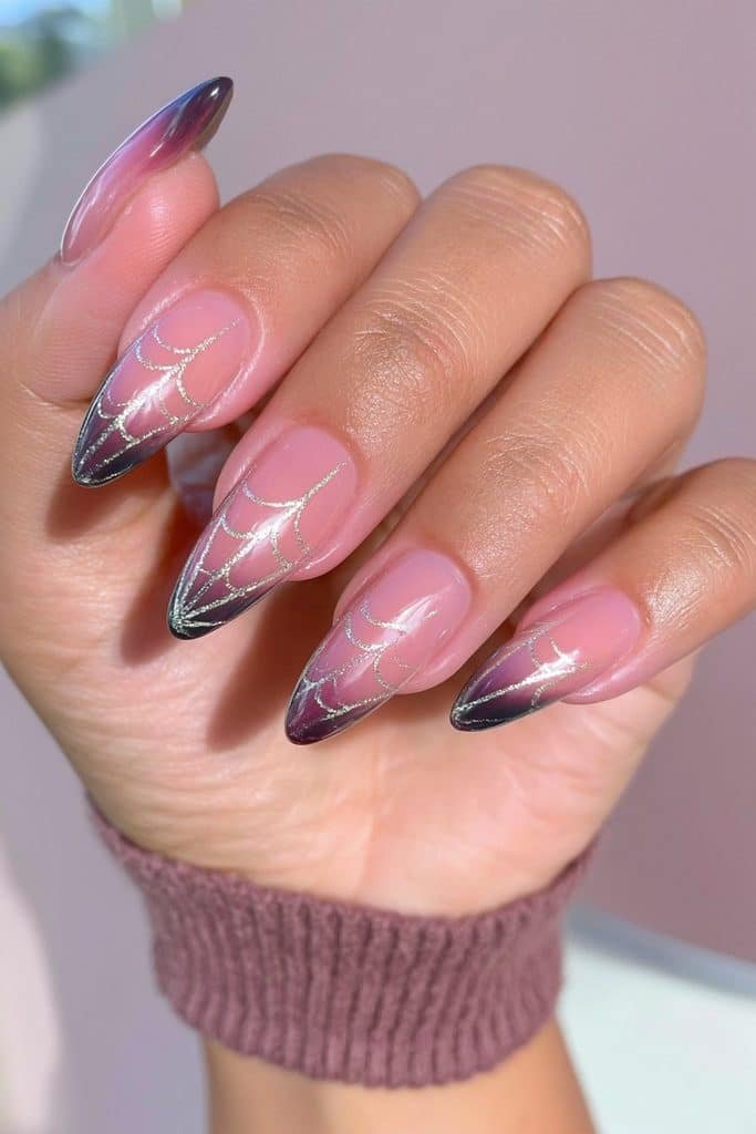 Almond spider web nails in deep plum and black with delicate silver web artwork