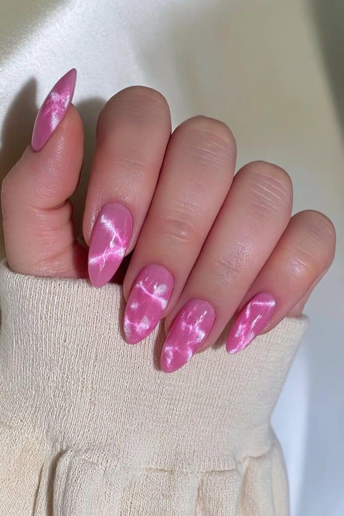 Ballet pink cat-eye nails with delicate satin-like magnetic bands and elegant milky pink undertones