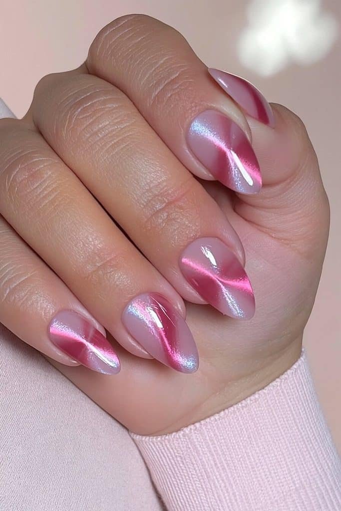 Barbie pink cat-eye nails with vibrant rosy ribbons, sparkling shimmer, and a glamorous glossy finish