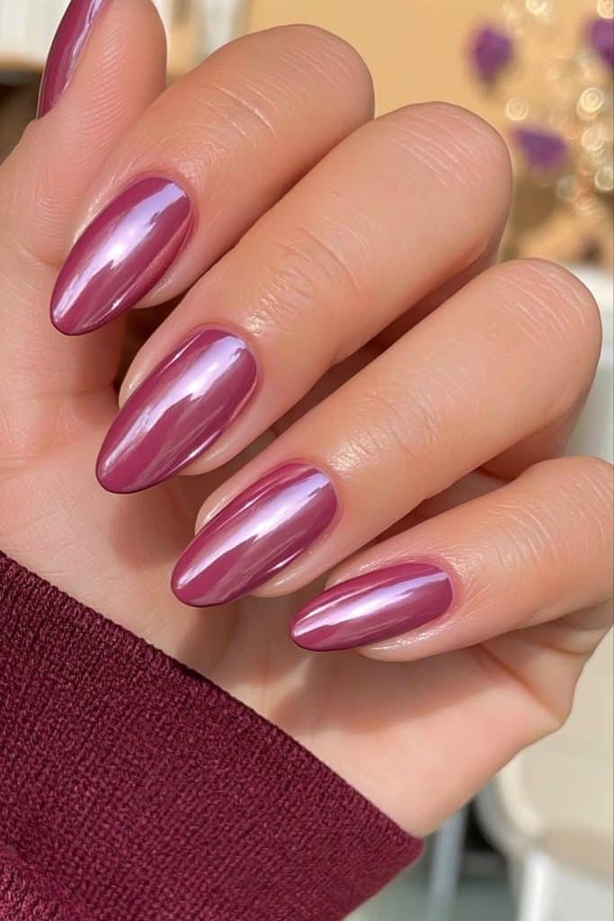 Berry plum chrome almond nails with raspberry, wine, and violet metallic reflections