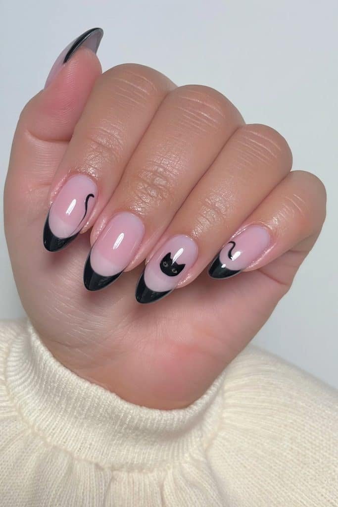 Black cat French tip nails with sheer pink bases and delicate cat silhouettes