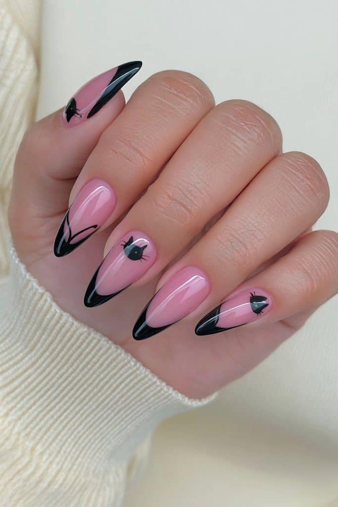 Blush pink nails with charming black cat illustrations and graceful curved tails