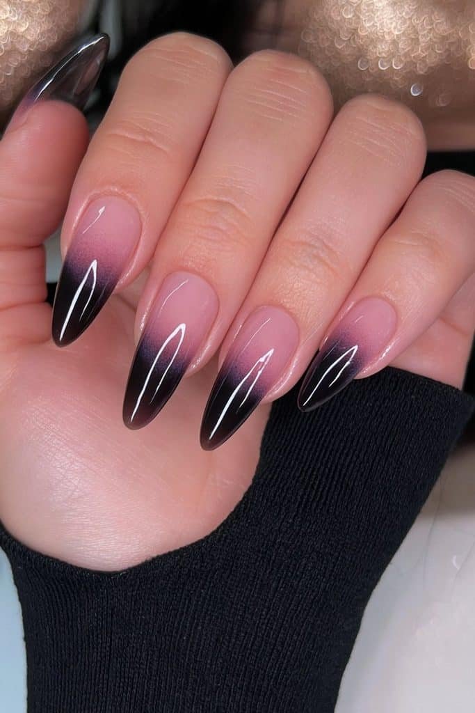 Translucent smoky black jelly nails with deep charcoal layers and glossy glass-like shine