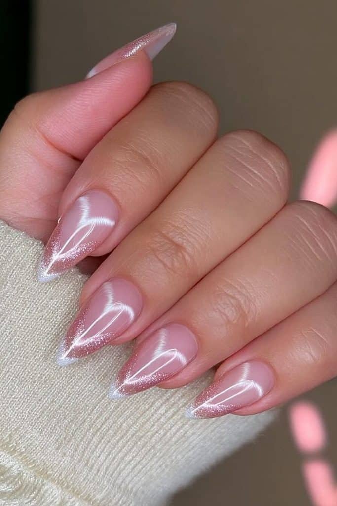 Blush pink velvet cat-eye nails with soft rose-gold reflections and luxurious pearlescent shimmer