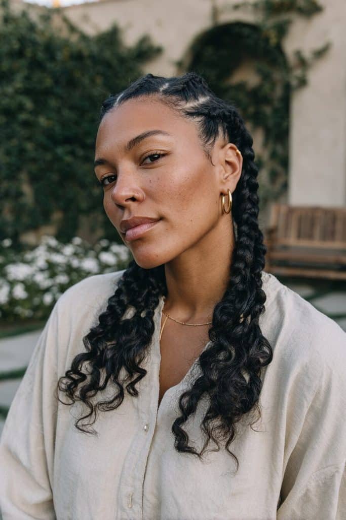 Boho goddess braids combining medium knotless plaits, flowing goddess-style braids, and soft loose curls.