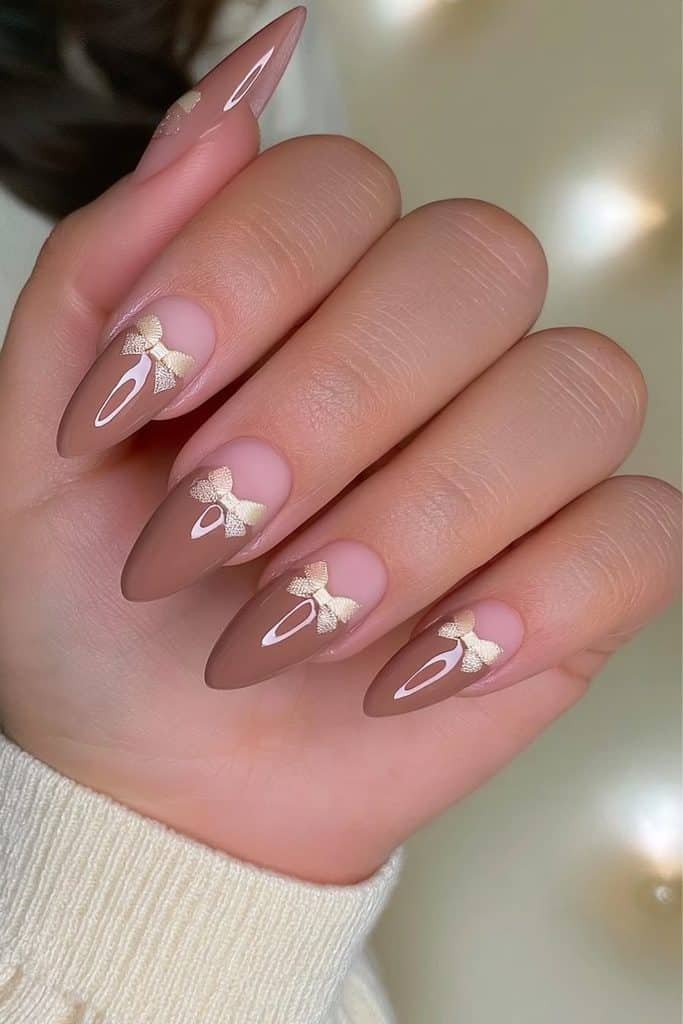 Mocha mousse nails with delicate cream ribbon bows and glossy coffee-brown polish