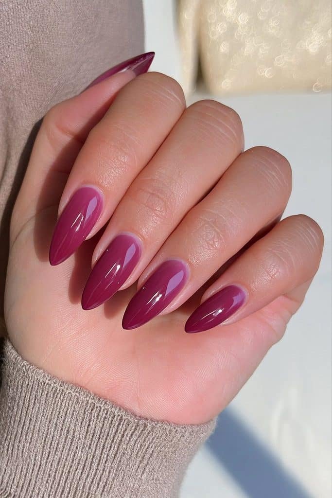 Classic burgundy almond nails with rich merlot color and glossy glass-like finish