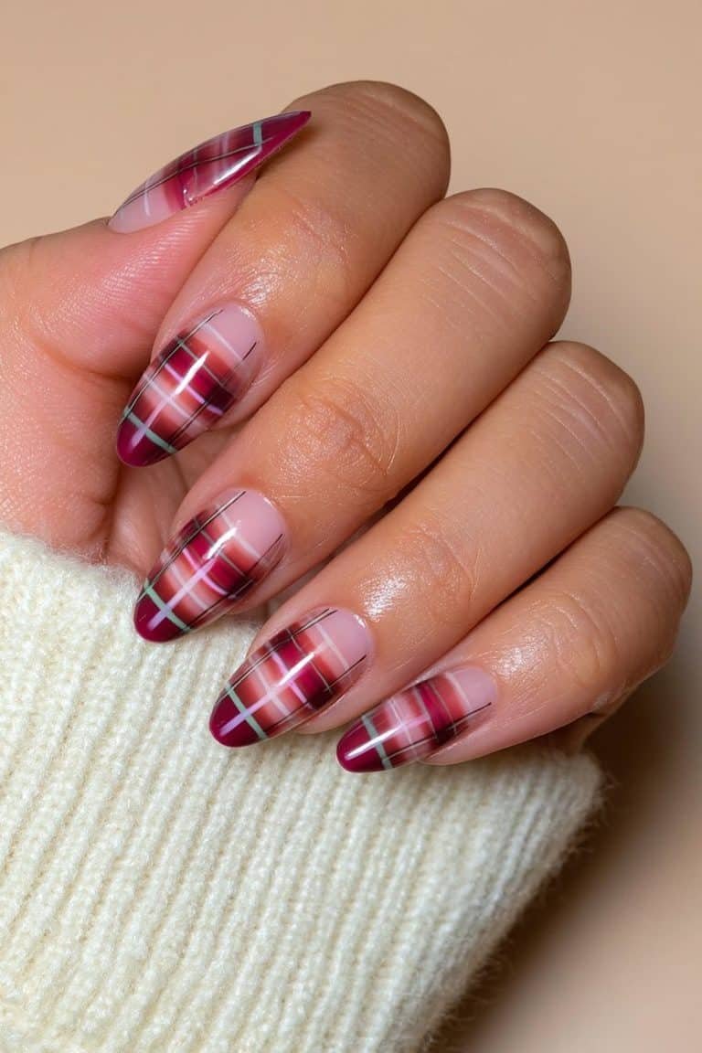 Burgundy plaid nails with fine wine-red lines over a warm nude and cream base