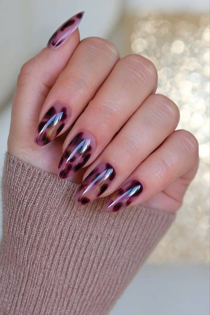 Burgundy tortoiseshell nails with translucent merlot, oxblood, brown, and amber layers