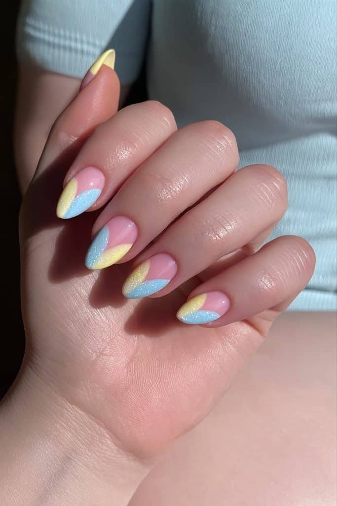 Butter yellow and baby blue pastel nails with alternating sunny yellow and powder blue shades
