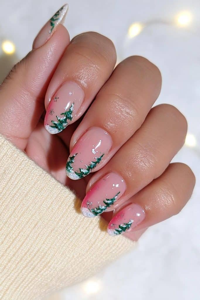 Deep-green French tip nails with tiny Christmas trees and gold stars