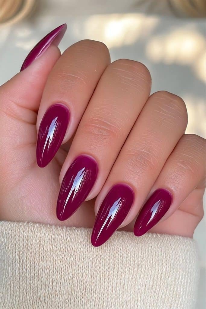 Classic glossy burgundy nails with rich wine-red color and an ultra-glossy salon finish