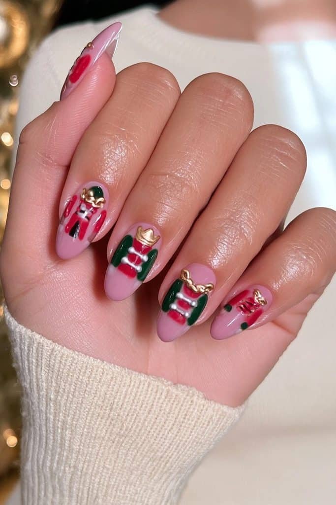 Classic red nutcracker soldier nails with forest-green accents, gold braid, and miniature buttons