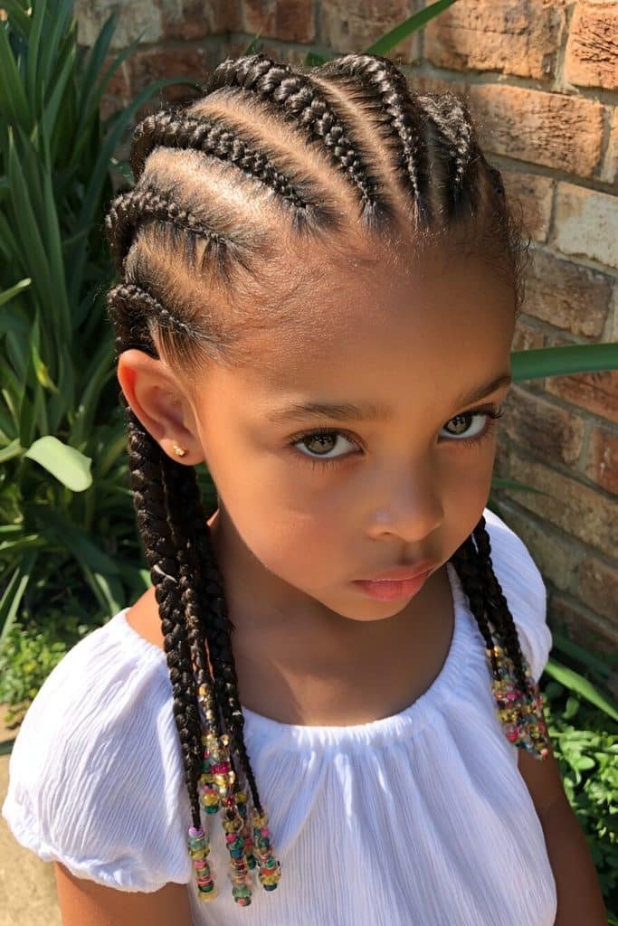 Kids cornrows with straight-back braided rows, clean curved hairlines, and colorful beads on the braid ends.