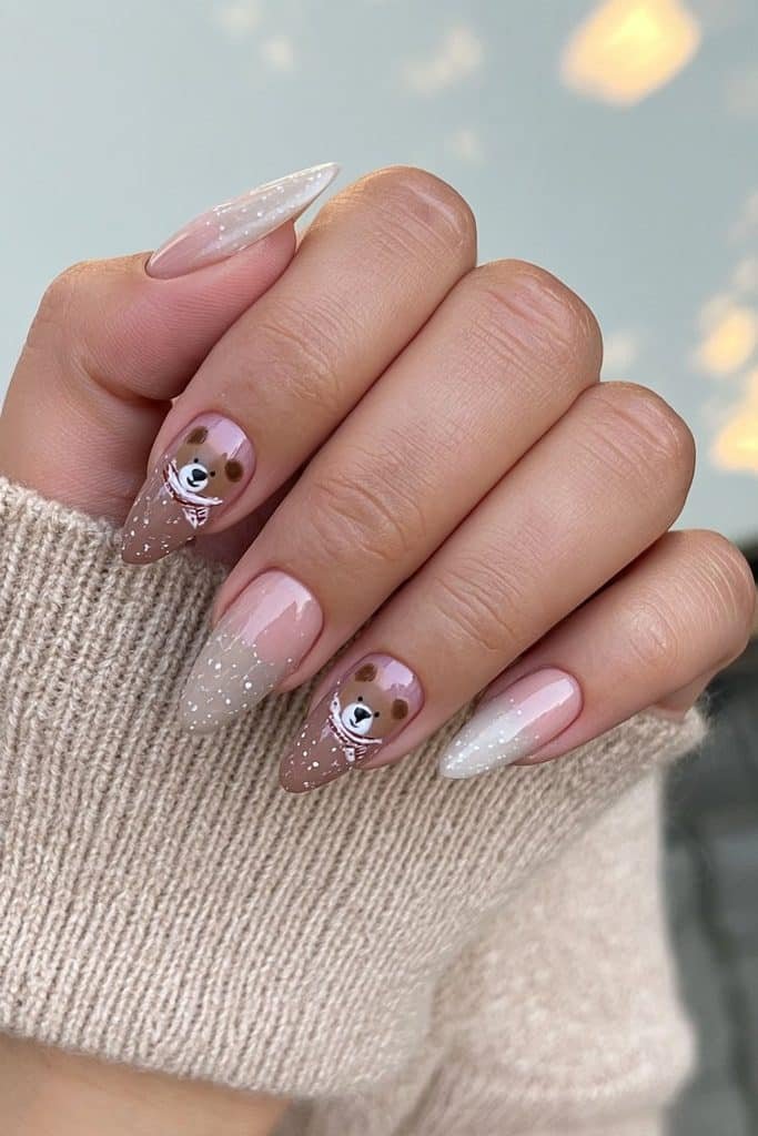 Cozy ski nails with tiny caramel teddy bears, winter scarves, and creamy beige accents