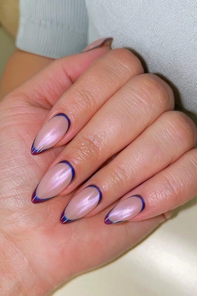 Dark blue reverse French cat-eye nails with sapphire cuticle arcs and a sheer milky base