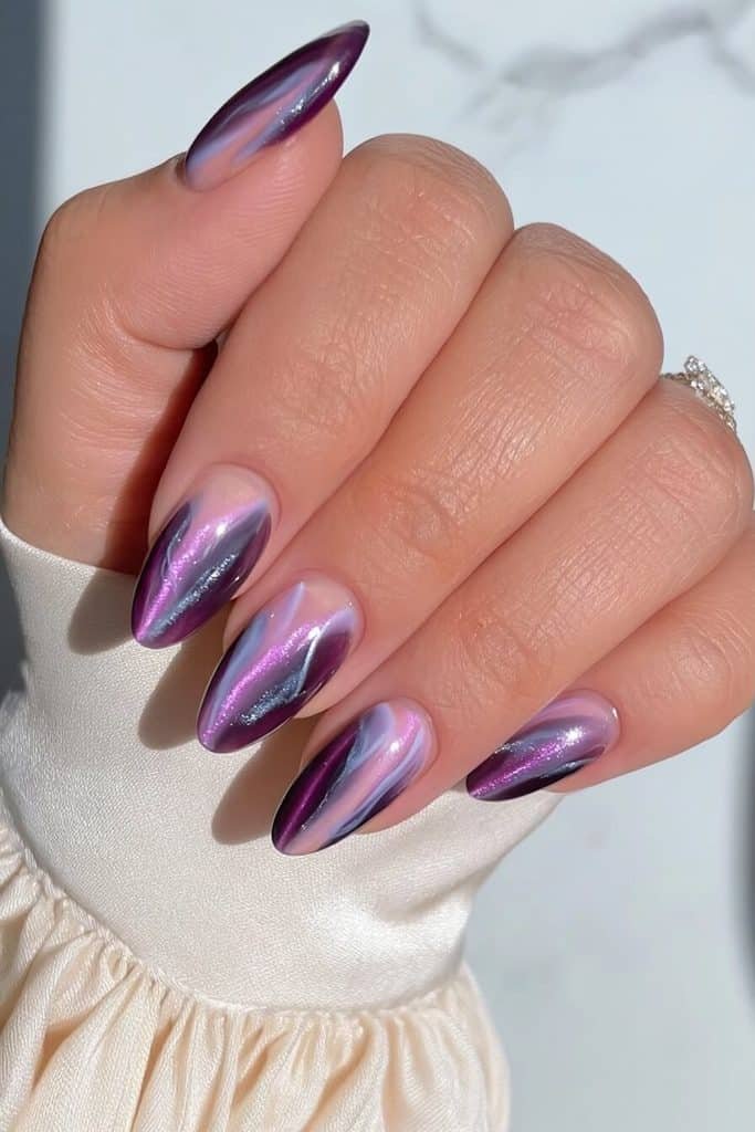 Dark purple cat-eye marble nails with lavender, smoky plum, and delicate silver veining
