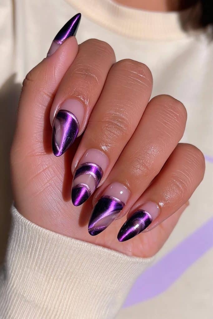Dark purple cat-eye nails with geometric violet sections, metallic outlines, and negative space