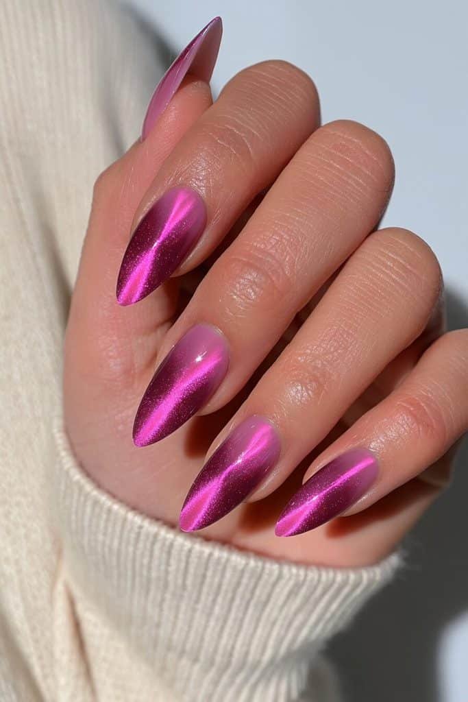 Deep orchid pink cat-eye nails with vivid fuchsia bands, rich magenta undertones, and dimensional shimmer