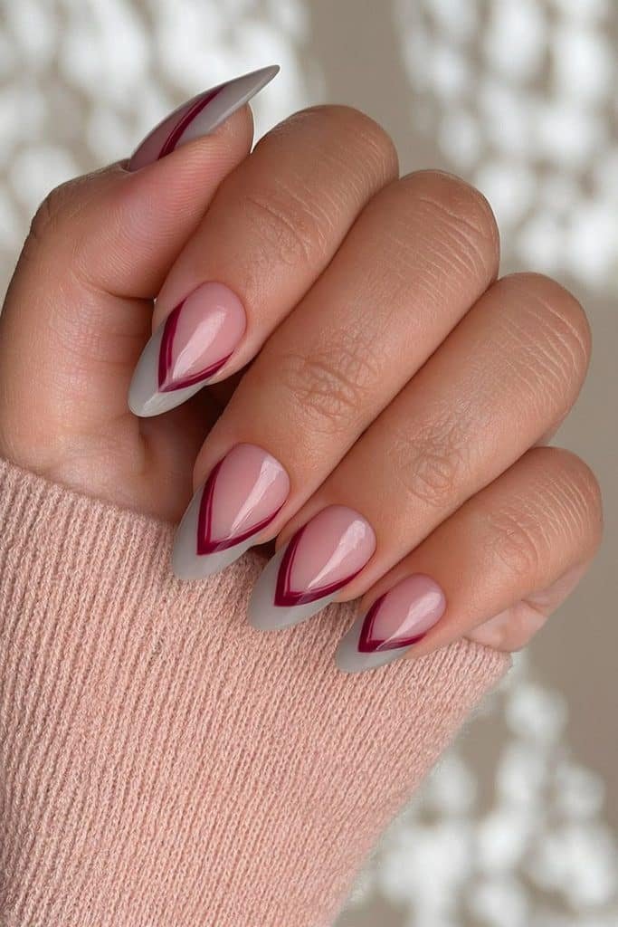Sheer nude nails with refined double burgundy French lines and glossy finish
