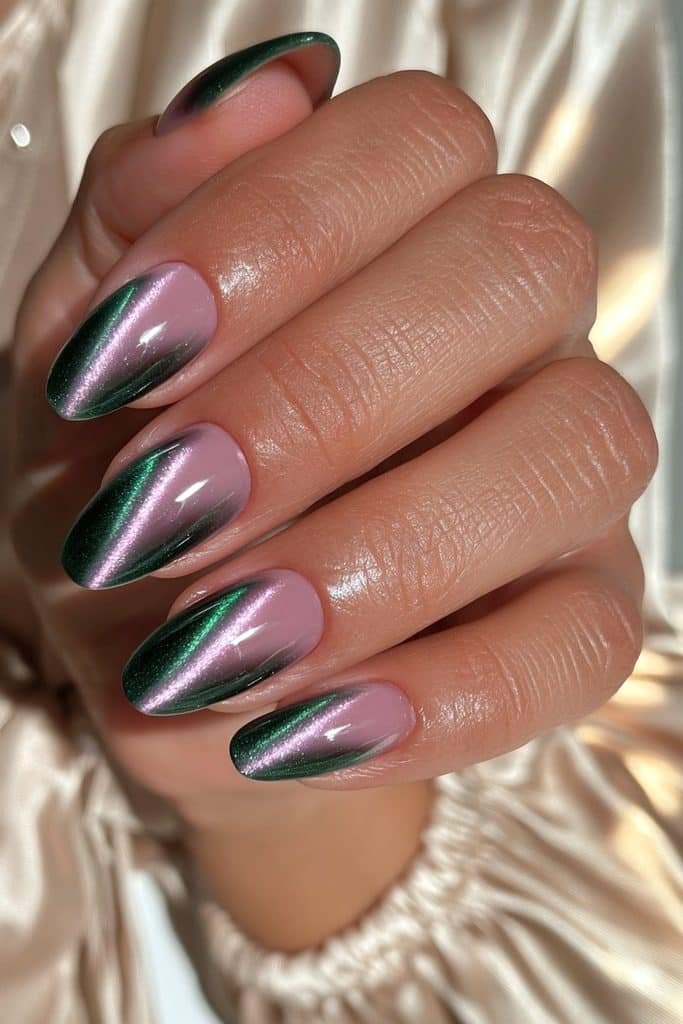Elegant emerald green cat eye nails with rich gemstone-like shimmer and a high-gloss finish.