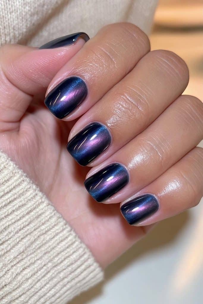 Everyday squoval navy cat-eye nails with softly rounded square tips and subtle sapphire shimmer