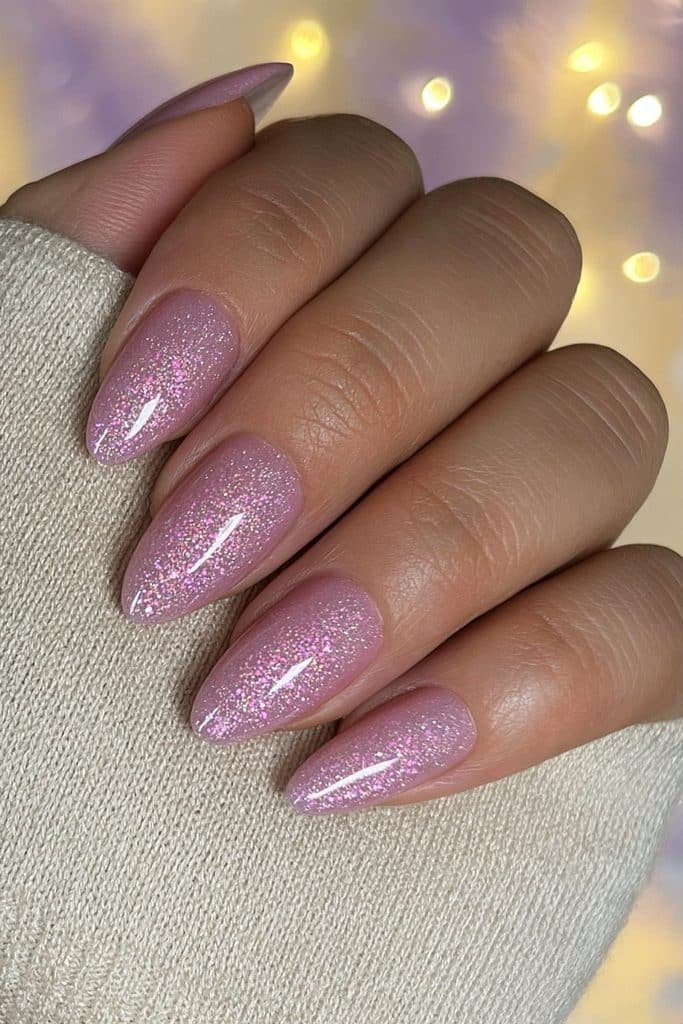 Sugar plum shimmer nails with fine pink-lilac sparkle and a glossy finish