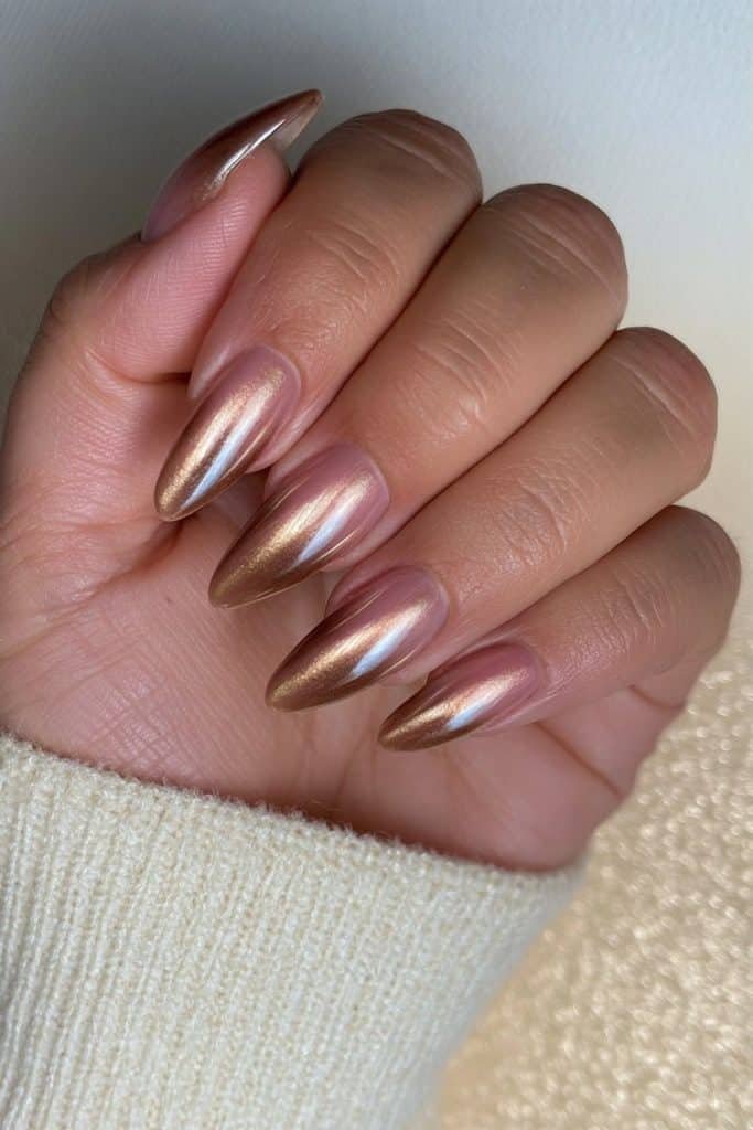 Glazed mocha mousse nails with creamy brown polish and a luminous pearl-champagne sheen