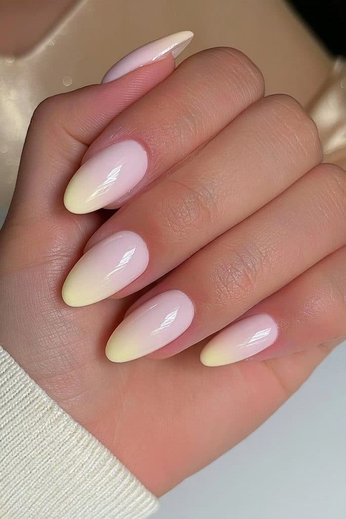 Glossy solid butter yellow nails with creamy pastel polish and a smooth glass-like finish