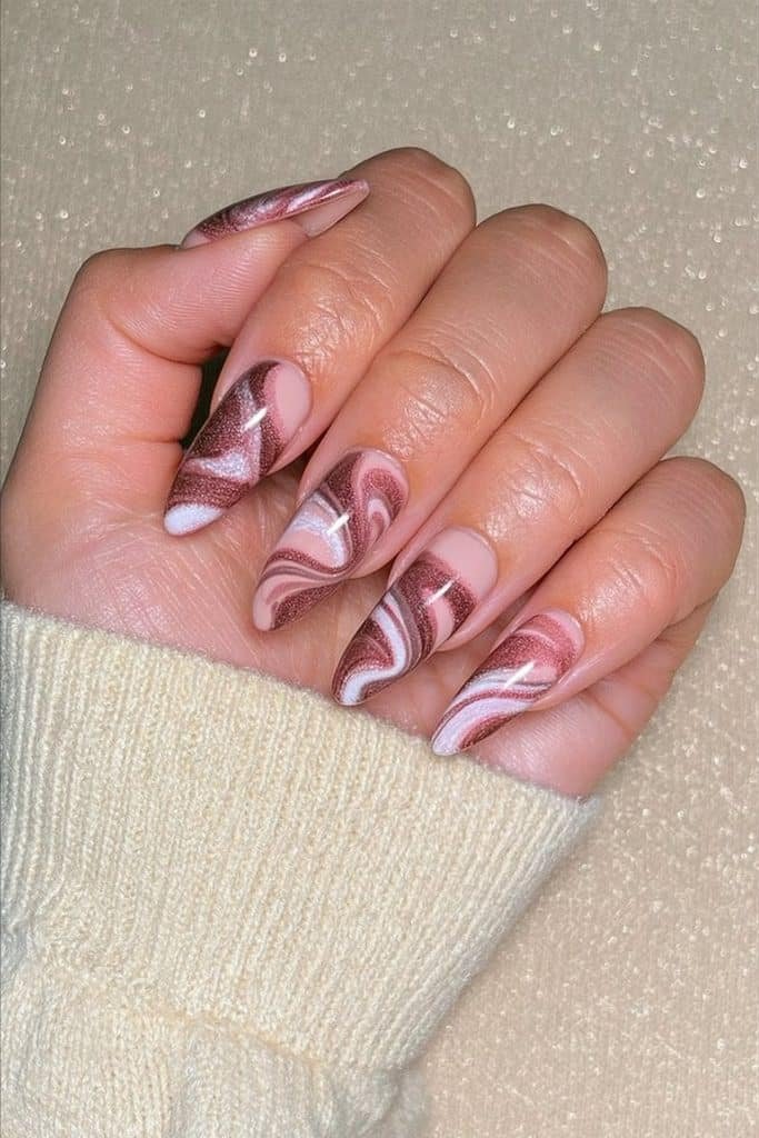 Hot cocoa swirl nails with rich chocolate brown, creamy latte, caramel, and marshmallow-white details