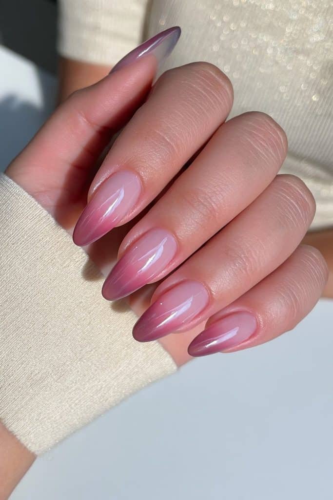 Translucent jelly ombré nails fading from milky nude to soft rosy pink