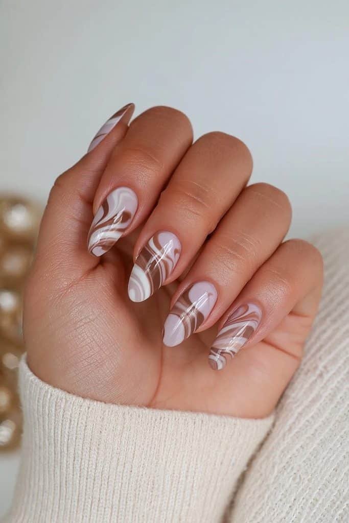 Latte swirl nails with flowing mocha, caramel, beige, and milky cream patterns