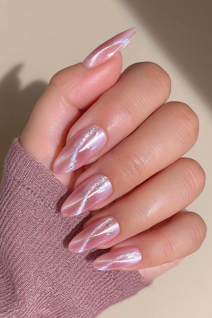 Mauve pink cat-eye nails with rosy-purple undertones, luminous violet-pink ribbons, and glossy polish