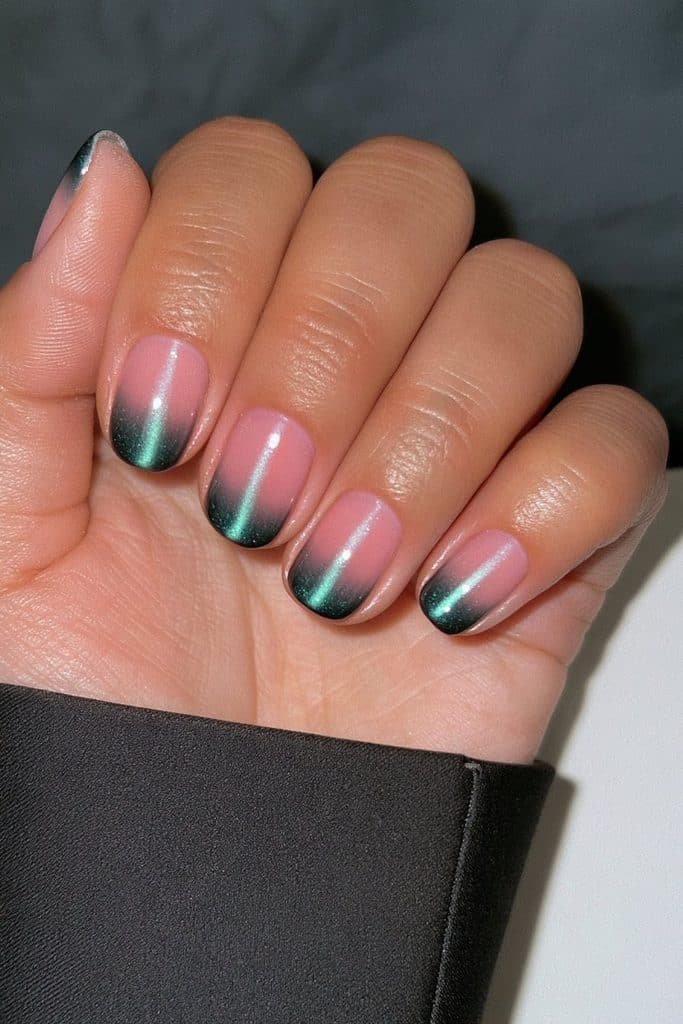 Nearly black midnight pine green cat eye nails with a subtle emerald magnetic glow and glossy finish.