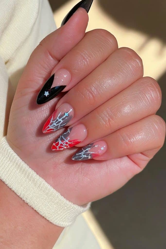 Mismatched spider web nails with black, blush pink, smoky purple, silver webs, and glitter accents