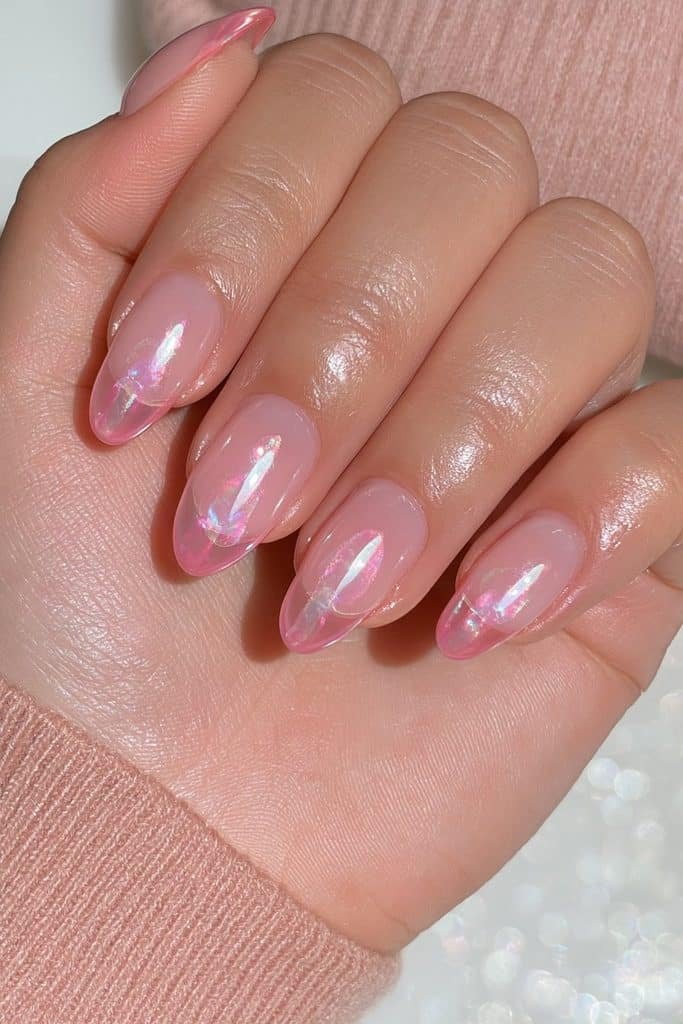 Translucent pearl pink jelly nails with soft pearlescent glow and glossy finish