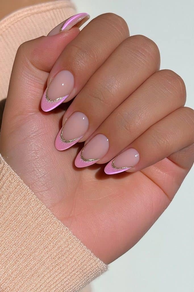 Pink cat-eye French tip nails with sheer milky bases and luminous rose-pink magnetic tips