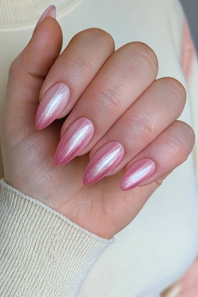 Pink ombre cat-eye nails blending pale baby pink into rich rose pink with luminous diagonal ribbons